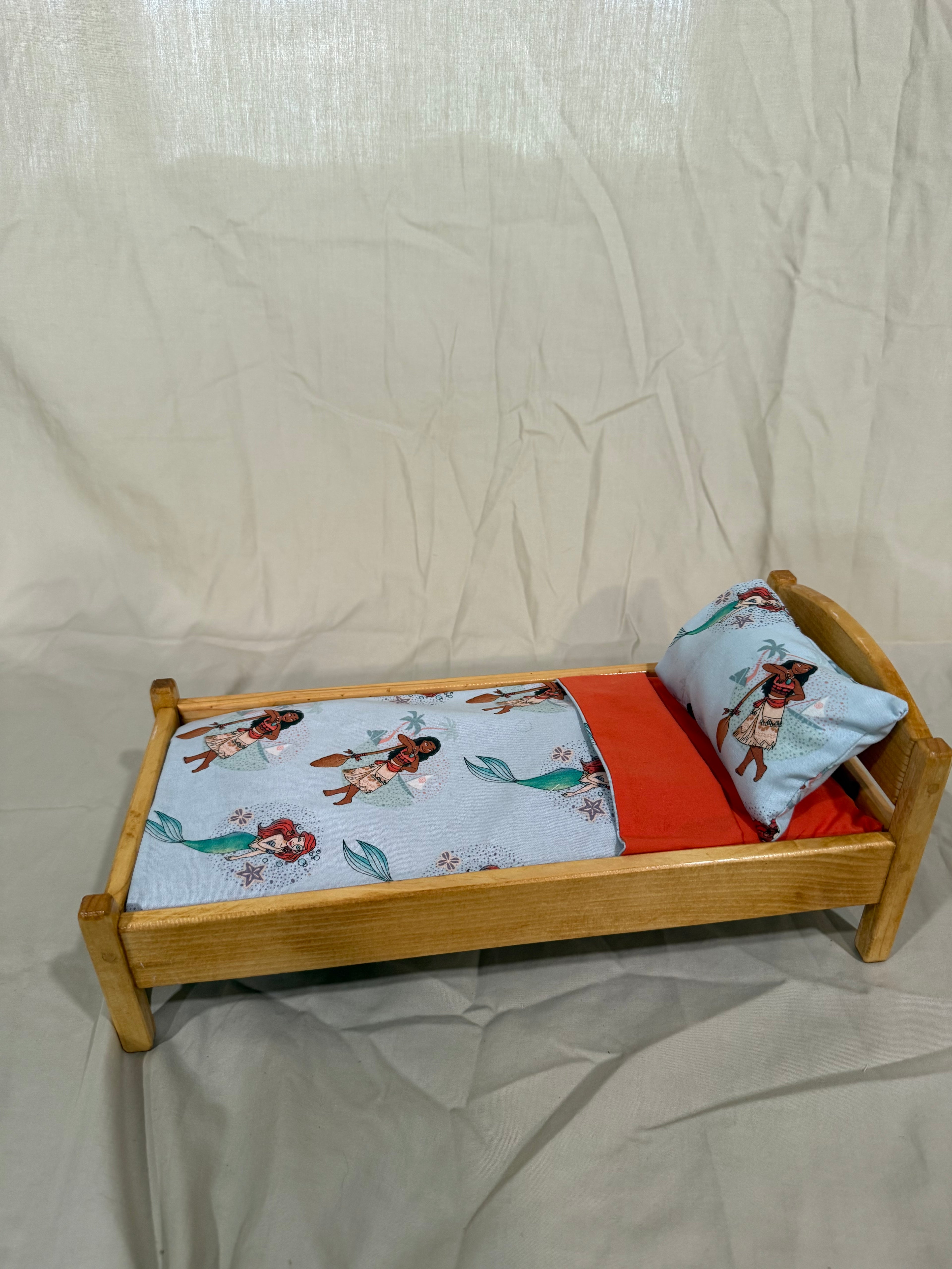 Barbie doll bed in multi-character bedding