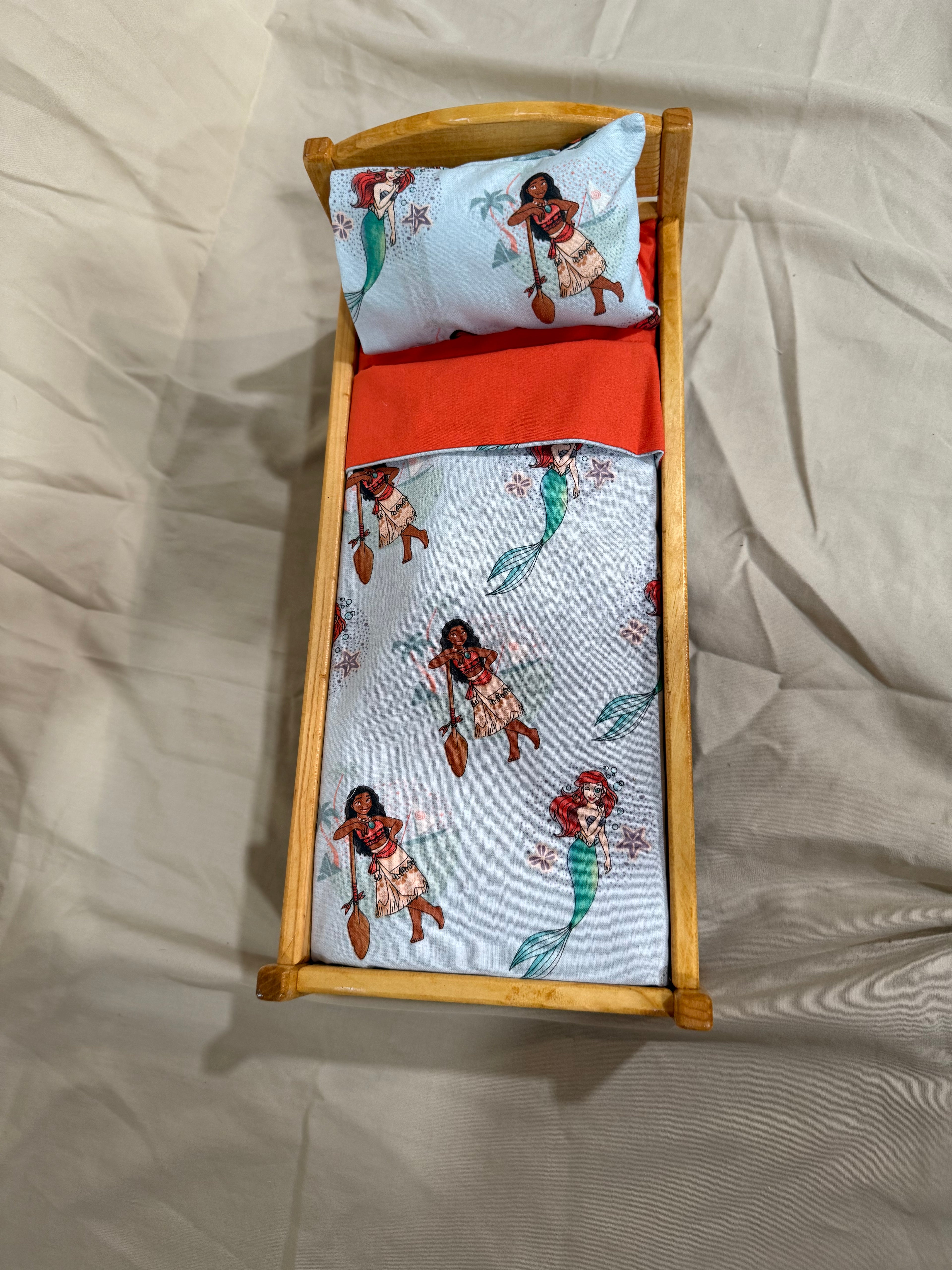 Barbie doll bed in multi-character bedding