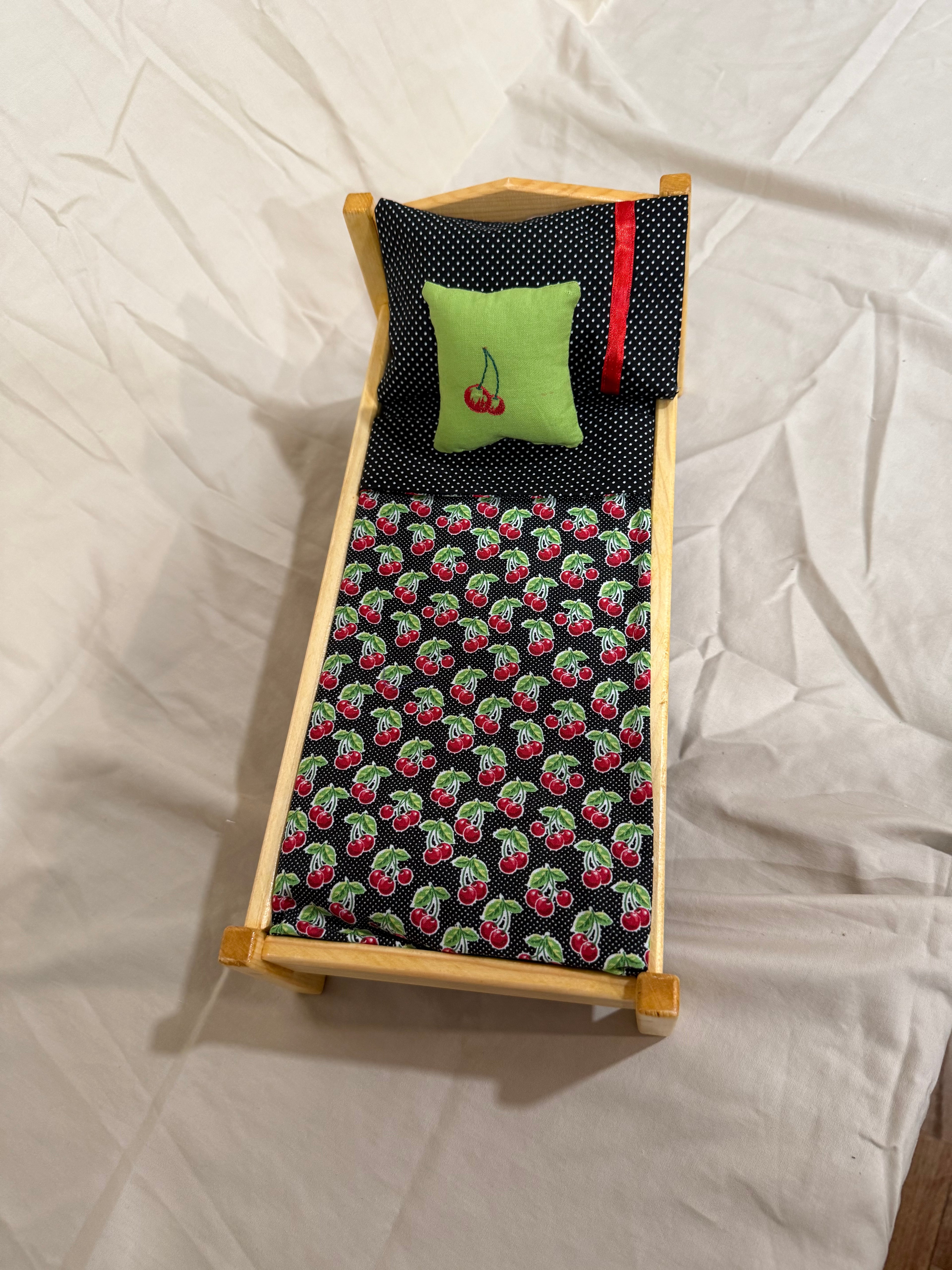 Barbie bed in cherry bedding